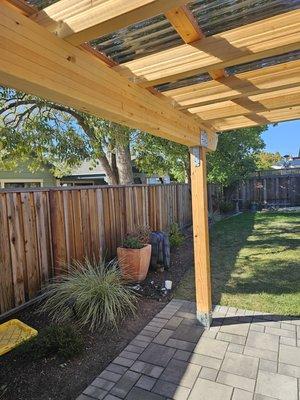 Santa Rosa waterproof patio cover with Alaskan Yellow Cedar Glu-lam beams and rafters.