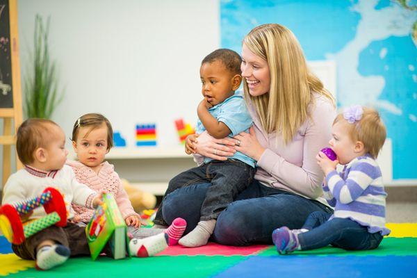 Young toddlers are  enjoying   circle time!