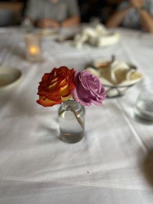 Beautiful live roses in the center of the table.