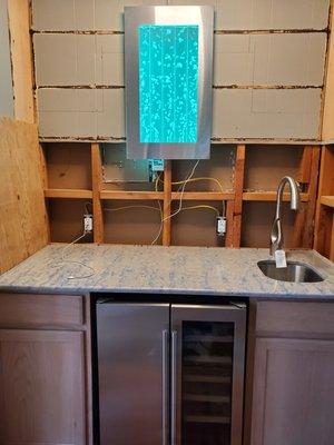 A funky little countertop for a wet bar turned wine bar.