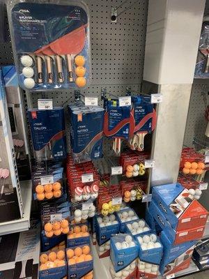 Huge selection of ping pong balls and paddles.