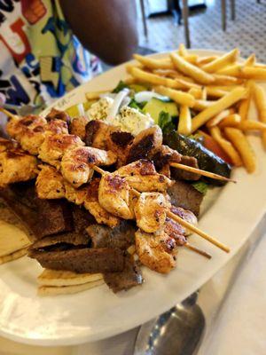 Lamb, chicken, stuffed collards, fries.