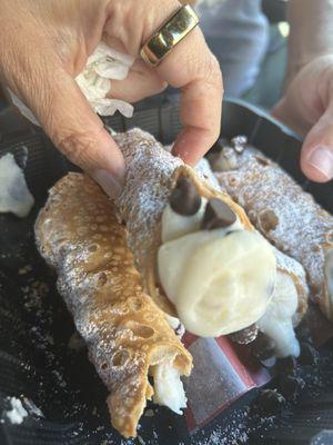 Looks can be deceiving-this Cannoli wasn't filled all the way. Look at the other picture. 7/2 Take out order.