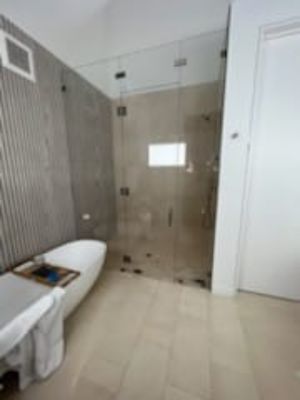 Demoed original bathroom. Built new shower, installed new wall and floor tile. Awesome