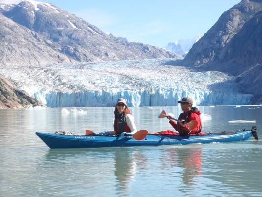 Kayak at the face of a glacier in Southeast Alaska