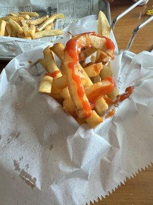 Overflowing Basket of French Fries.