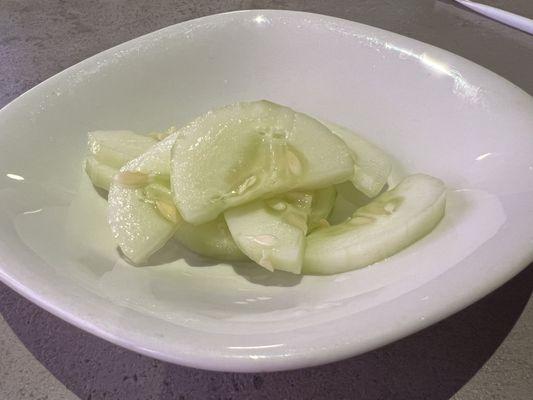 These sliced pickled cucumbers are placed on the table after you place your order.