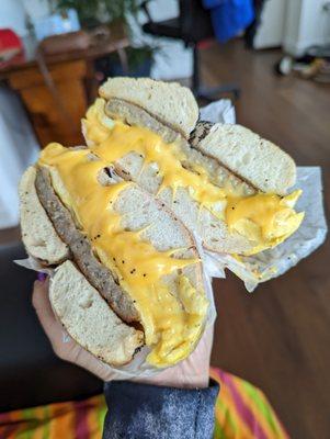 sausage egg and cheese on a sesame bagel