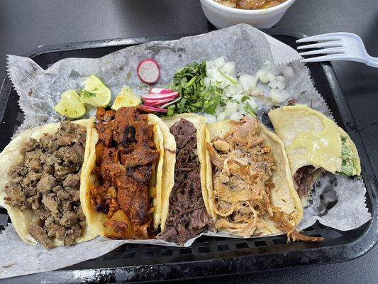 5 taco plate.  Beef, Pastor, Barbacoa, Carnitas and Cachete.  Cachete my fav.