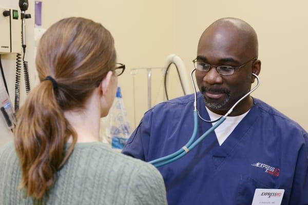 Dr. Asamoah examining patient