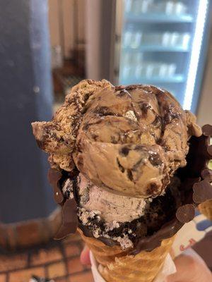 Almond mocha and cookie and creams on a chocolate dipped waffle cone