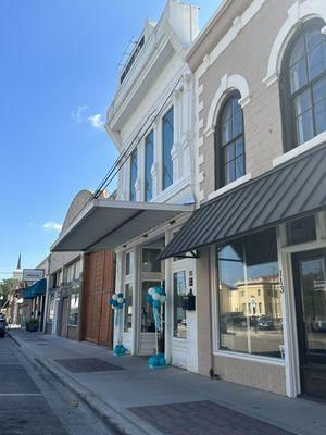 Tirzah - Facade Street View with Turquoise Balloons at Entrance