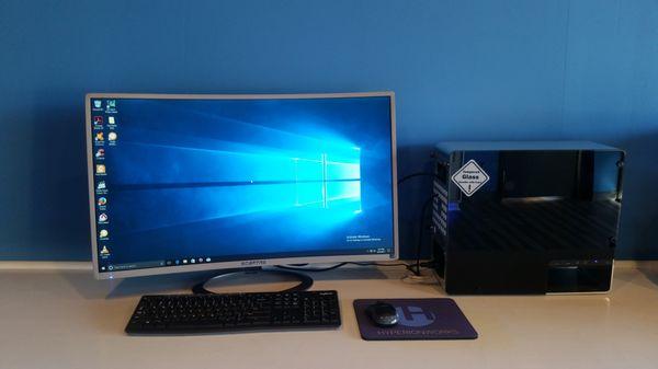 Polaris 100, brushed metal and tempered glass case, curved 32" monitor.