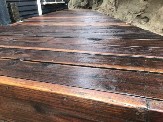 Small redwood deck we refinished and treated with linseed oil and sealant.