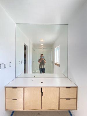 Vanity with full wall mirror