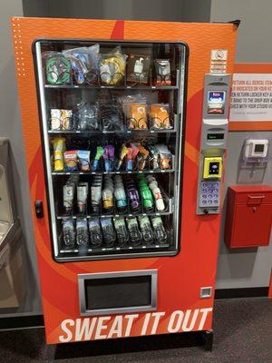 Vending machine with snacks and workout accessories