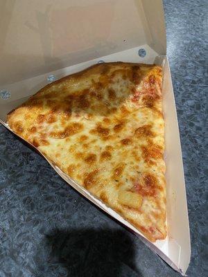 Cheese pizza with a random chunk of pineapple