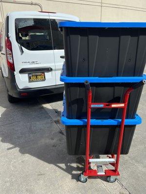 Loading up customer storage bins into the van and heading to our warehouse to store them.