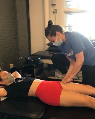 Our physical therapist Alina working with a patient.