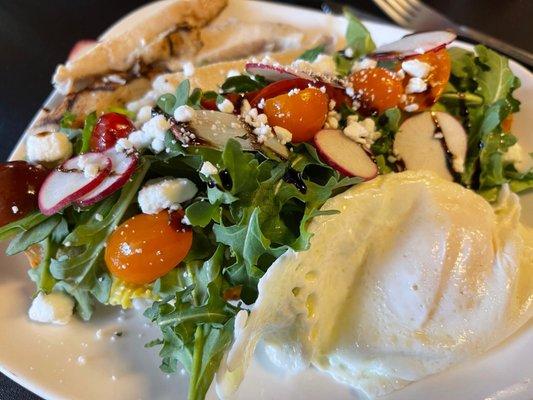 Avocado toast, with chicken and an over medium egg.