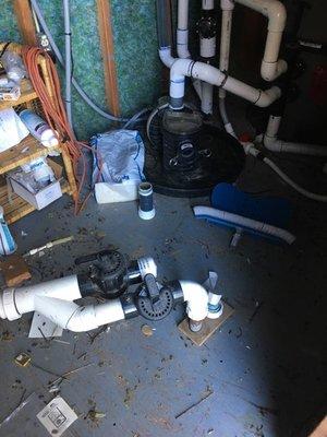 Original plumbing mess in pump room, no surprise it had leaks!