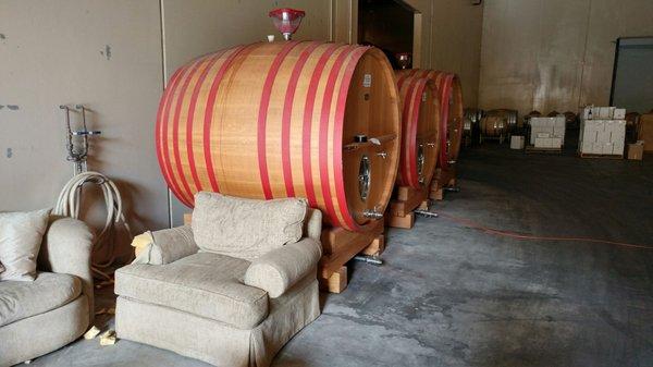 huge barrels in tasting room / warehouse...furniture puts it in perspective