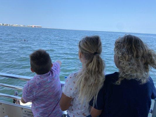 Kids watching for dolphins.