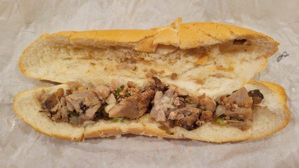 Grilled pork banh mi. That's all of meat you get. No grill flavor. Weak pork flavor. Baguette is badly cracked.