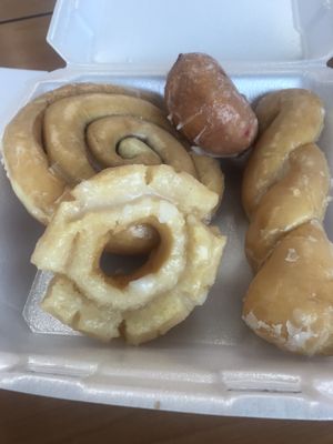 Cinnamon bun, strawberry cake, glazed twist, and buttermilk donut