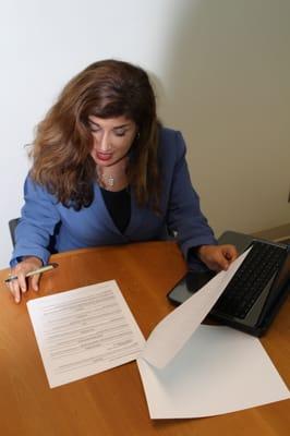 Attorney at Law, Raquel Kuronen at West La Law, PC working on my new business contract.