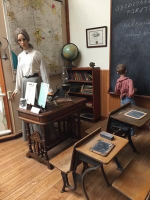 Old school room display, with a tiny desk.