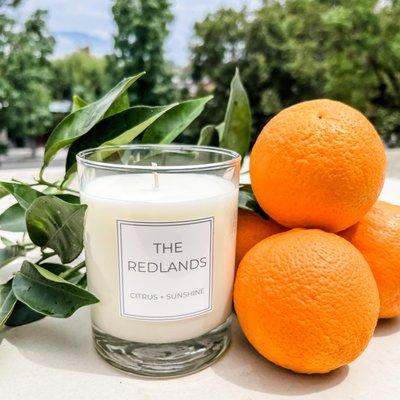 The Redlands Candle. With refreshing notes of Citrus + Sunshine. Available on https://shop.getthetreatment.com/