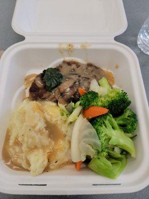 Steak with mashed potatoes and steamed veggies