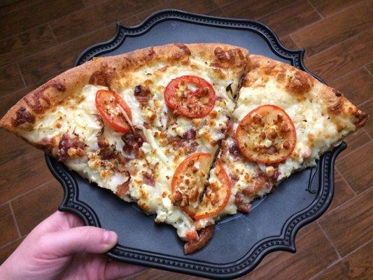 We got the "award winning" White Cheezy large pizza. It's a white pizza with tomatoes bacon and onions.  so damn good!