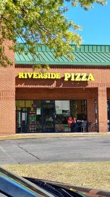 Enjoy outside seating on a beautiful day like this with a good slice of pizza.