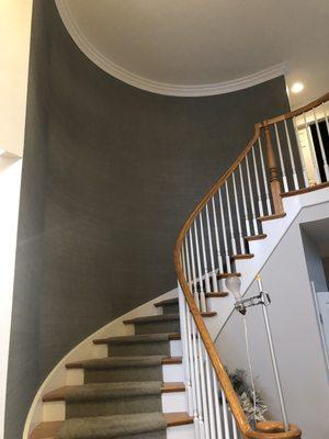 This is a curved staircase we papered. Our client was thrilled.