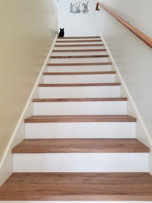 lvp stairs made with the same lvp flooring. combo with white risers