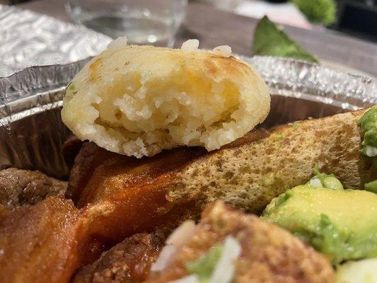 Hard/dry corn cake in the Bandeja Paisa (grilled steak, pork skin, egg, sausage, corn cake, sweet plantain and avocado) for $17