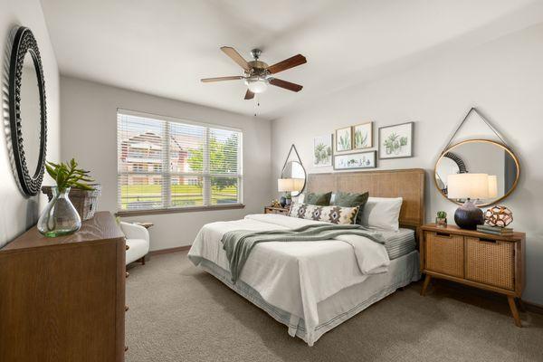 Bedroom with ceiling fan at Estates of Richardson