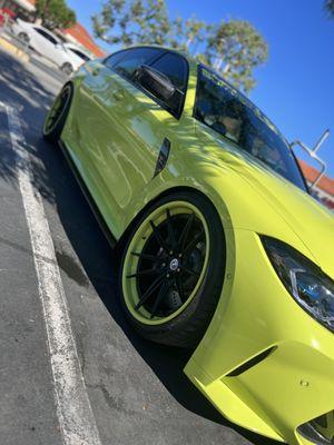 BMW M3 with custom wheels and lowered suspension.