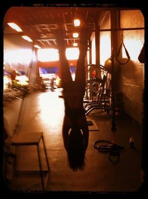 David hving me hanging upside down on inversion boots. good for lower back, ab work. And he was right!