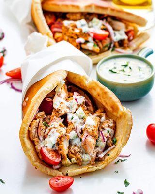 Chicken Gyro
made with tender flavored chicken, lettuce, tomatoes, onions, and a tangy siracha sauce, all wrapped in a warm pita.