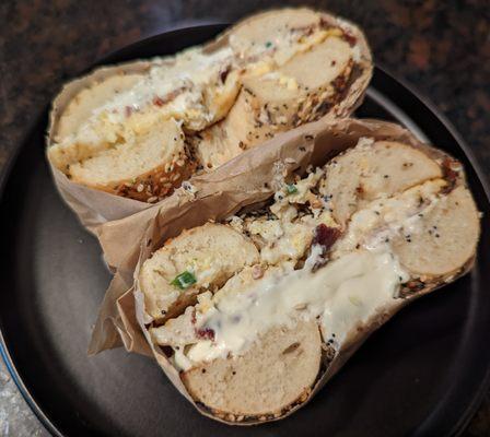 Everything bagel with scallion cream cheese, scrambled eggs, and bacon