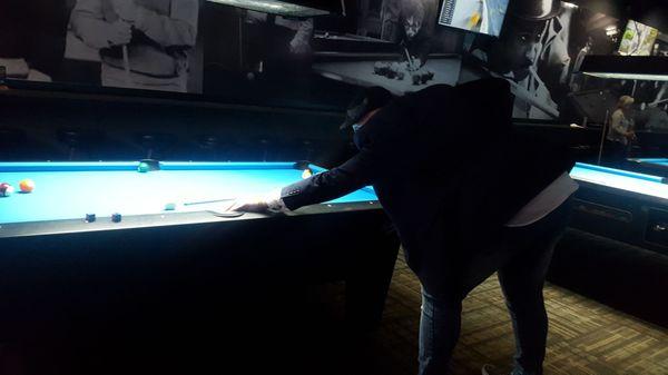 Playing pool.