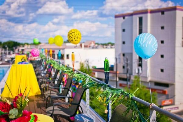 The Lofts Condos rooftop pool is looking festive for our annual Summer Luau Pool Party!