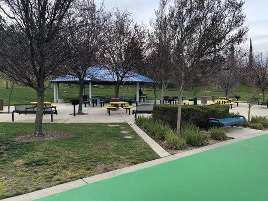 Beautiful park with lots of amenities such as play area for toddlers and older children, fenced and painted floor basketball court, and more