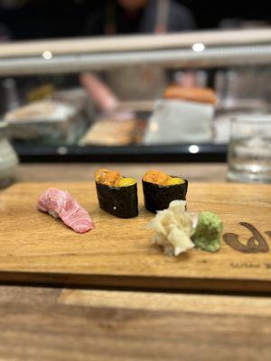 Sea Urchin topped with quail egg and O Chu Toro (Medium Fatty Tuna) 1pc