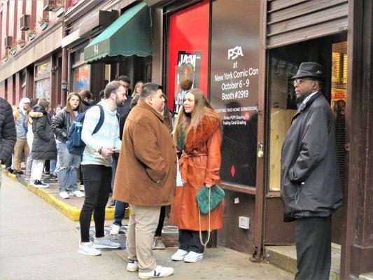 Bleecker Trading with long line of folks waiting their turn for a meet and greet with Q96.