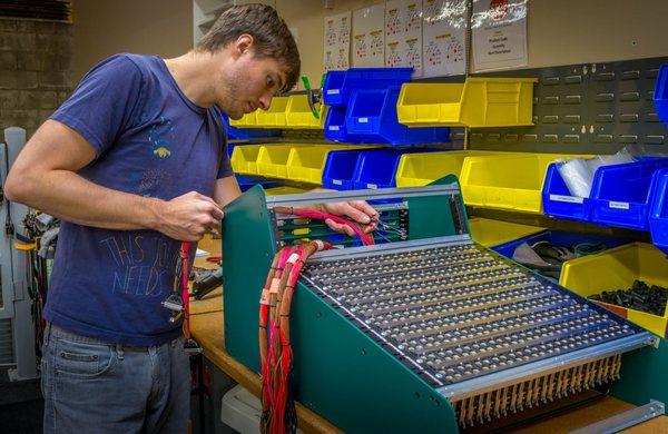 Adam In the Cable Shop Working On a Custom Patchbay for a Local Client. We Offer Complete Studio Wiring Solutions & On-Site Installations.