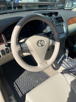 Leather steering wheel wrap on a Toyota Camry